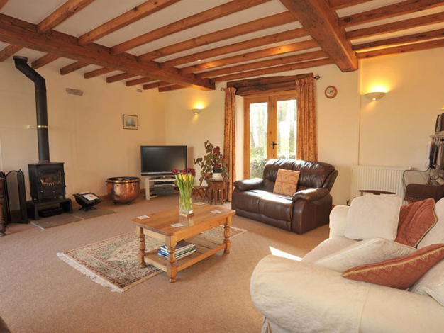 Maigold Cottage, Lounge with cosy woodburner and piano, Image 3