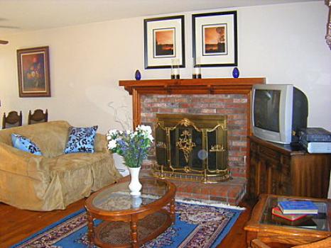 Bayview Getaway, Living room with fireplace, Image 3